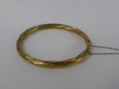 A Lady's 9 Ct Gold 375 Hallmark Twisted Bangle Bracelet, approx wt 11 gms.