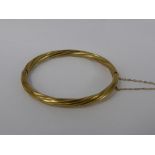 A Lady's 9 Ct Gold 375 Hallmark Twisted Bangle Bracelet, approx wt 11 gms.