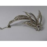 A Lady's Platinum and Diamond Floral Brooch, 1 x 25 pt brilliant cut, 40 pts bag cuts, 66 pts of 8