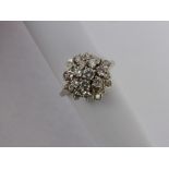 A Lady's 18 ct White Gold and Diamond Cluster Ring, size N, 64 pts total dias, approx 5.7 gms.