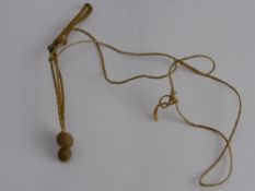 An Antique Vellum Talisman, on braided hair neckace.