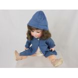 An Antique German Porcelain Headed Doll, the doll having open and closing eyes with impressed