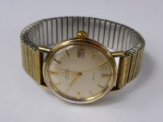 A Gentleman's 9ct Gold Omega Automatic De Ville Seamaster Wrist Watch, the watch having a