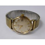 A Gentleman's 9ct Gold Omega Automatic De Ville Seamaster Wrist Watch, the watch having a