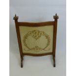 An Oak Turpentine Fronted Fire Screen together with an elm nursery chair. (2)