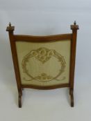 An Oak Turpentine Fronted Fire Screen together with an elm nursery chair. (2)