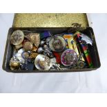 A Tin Containing a Selection of Military Lapel Badges, Fusiliers, RAF, Land Army and Royal