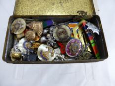 A Tin Containing a Selection of Military Lapel Badges, Fusiliers, RAF, Land Army and Royal