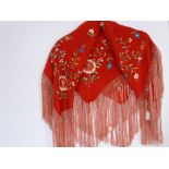 A Fringed Red Silk Mini Shawl with floral embroidered design.