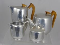 An Art Deco Style Brushed Steel Tea and Coffee Pot, together with a milk jug and sugar bowl.