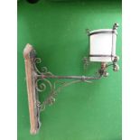 Seven Decorative Wrought Iron Exterior Wall Lights, some with original glass shades.