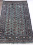 A Pakistani Rug, with central ghouls on Celadon green ground, approx 125 x 190 cms