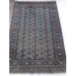 A Pakistani Rug, with central ghouls on Celadon green ground, approx 125 x 190 cms