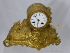 A Victorian Brass Mantel Clock, the clock depicting birds on a branch. WF.