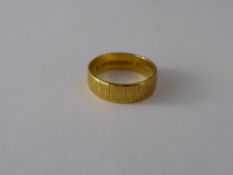 A 22 Ct Yellow Gold Bark Finish Wedding Band, size K, approx wt 4.2 gms.