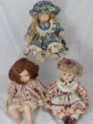 Three Leonardo Collection Porcelain Headed Dolls, in traditional costume with hand painted faces