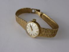 A Lady's 9 ct Marvin Cocktail Watch, the watch having a white face with baton numerals and on 9 ct