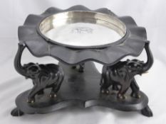 An Ebonised Indian Fruit Stand, the stand having three carved elephant supports with silver metal
