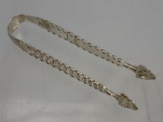 A Solid Silver Pair of Sugar Tongs, mm W.C., (William Chauner).