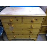 A Pine Chest of Drawers with two small drawers and three long drawers.