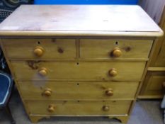 A Pine Chest of Drawers with two small drawers and three long drawers.