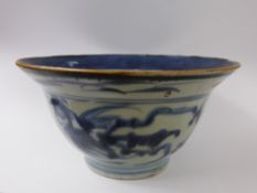 A Chinese Provincial Blue and White Bowl, with blue character marks and double rings to base.