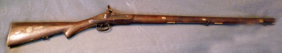 A 19th Century Musket. semi pistol grip stock with brass fittings, hinged wadding and bullet holders