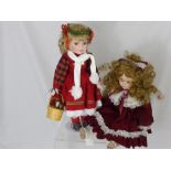 Two Leonardo Porcelain Headed Dolls, including "Christmas Miss" in original box and "Victorian