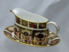 A Royal Crown Crown Derby Imari Pattern Gravy Boat and Saucer, pattern no. 1128.