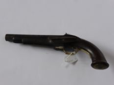 A 19th Century Cap and Ball Belt Pistol, walnut stock with brass trigger guard and decorated