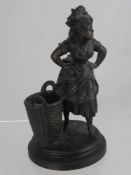 An Antique Metal Figure of a Washerwoman, marks to base L.S.F.96, approx 20 cms high.