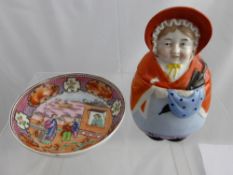 An Antique Famille Rose Tea Bowl, together with a German pottery figure of Mrs Sarie Gamp. (2)