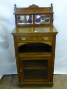 An Antique Rosewood Music Cabinet, having inlaid front with mirrored back and glazed cupboard front,