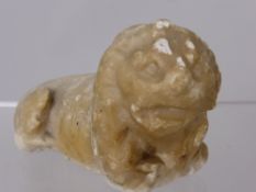 An Antique Marble Figure of a Lion, approx 12 x 6 cms.