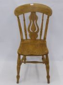 A Vintage Pine Kitchen Chair, with lyre back and turned legs.