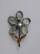 An Antique Gold and Moonstone Brooch, the brooch in the form of a flower.