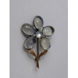 An Antique Gold and Moonstone Brooch, the brooch in the form of a flower.