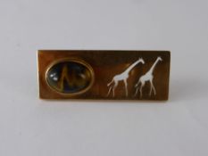 A 9 ct Gold and Tiger's Eye Brooch, depicting giraffes stamped Hand Made South Africa.