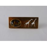 A 9 ct Gold and Tiger's Eye Brooch, depicting giraffes stamped Hand Made South Africa.