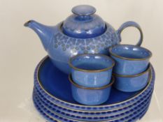 A Denby Stoneware "Midnight" Teapot, together with six dinner plates and four ramikins. (11)