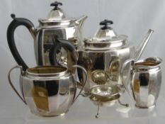 An Art Deco Style Solid Silver Tea Set, comprising tea pot, coffee pot, sugar bowl and a jug.