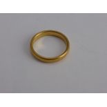 A 22 ct Yellow Gold Wedding Ring, mm WW Ltd., size P, approx wt 5.3 gms.