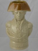 A Staffordshire Stoneware Character Jug, of Admiral Nelson with brown glazed hat over quarter length