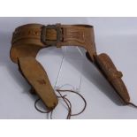 A Hand Made Western Style Leather Tool, double pistol holster, 'Made to order only by J. Lowrrie