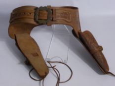 A Hand Made Western Style Leather Tool, double pistol holster, 'Made to order only by J. Lowrrie