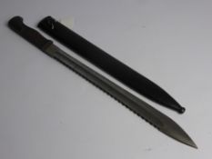 A German Sawback Bayonet, believed to be a unfinished proto-type. The Bayonet and Scabbard are