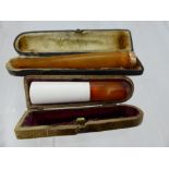 An Amber and 9 ct Gold Cigarette Holder, Birmingham hallmark dd 1912 mm A..F.& Co., in the