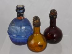 A Pair of Early Glass Flasks, including an amber decanter stamped Chateau de Conde with original wax