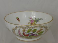 A Porcelain Fruit Bowl, the fluted bowl decorated with fruit and exotic birds in four cartouche,