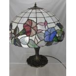 A Tiffany Style Lamp on Naturalistic Base, the shade depicting a Morning Glory design, approx 70 cms